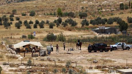 Israeli settlers in Masafer Yatta in the West Bank, June 19, 2026.
