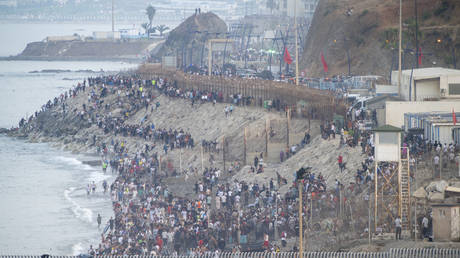 Thousands of migrants cross the border between Ceuta and Morocco, on 31 July, 2026 in Ceuta, Spain
