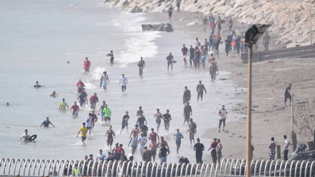 Migrants attempt to swim across the Spanish border from Morocco at Ceuta, Spain, July 30, 2026 ©  Getty Images