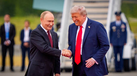 FILE PHOTO: US President Donald Trump greets Russian President Vladimir Putin in Anchorage, Alaska, August 15, 2025