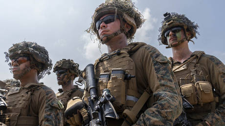 US Marines stand on a beach in Sattahip, Thailand, after taking part in the military exercises, on February 26, 2026.