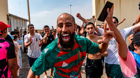 Migrants crossing from Morocco into the Spanish enclave of Ceuta, Thursday, July 30, 2026.