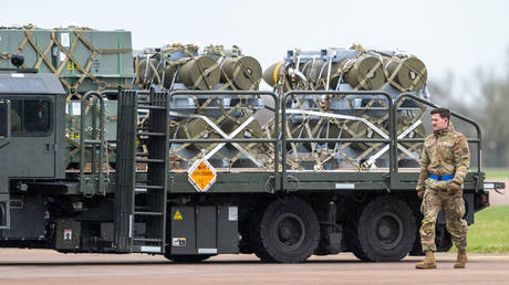 FILE PHOTO: US troops transporting the aerial bomobs at a base in the UK.
