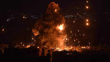 Smoke and flames rise among the residential buildings following an Israeli attack on Dahieh region in Beirut, Lebanon.