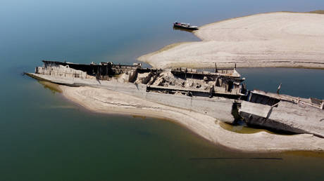 A view of the wreckage of a WWII German warship in front of Djerdap II, a large dam on the Danube River, between Romania and Serbia, near Prahovo, Serbia, August 4, 2026.