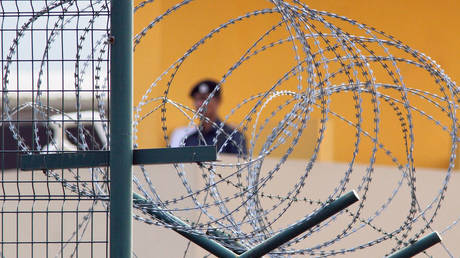 A guard keeps watch over Changi Prison November 24, 2005 in Singapore