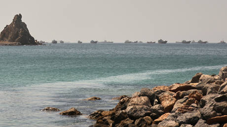 FILE PHOTO: Tankers and cargo vessels in the Gulf of Oman in June 2026.