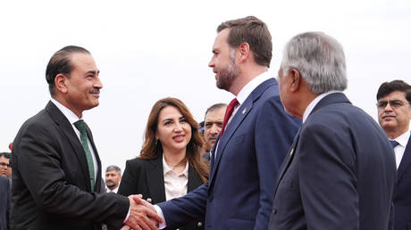 US Vice President JD Vance shakes hands with Pakistani Field Marshall Asim Munir as US Charge d'Affaires Natalie Baker looks on, in Islamabad, on April 11, 2026.