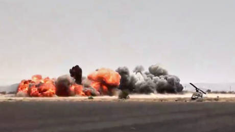 Houthi-controlled news channel Al-Masirah TV shows an explosion at the Sanaa International Airport in Yemen, July 13, 2026.
