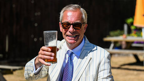 Nigel Farage is seen drinking a pint on election day in Clacton, England, August 13, 2026