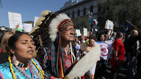 FILE PHOTO: Chief Phil Lane marches with demonstrators at the ‘Forward on Climate’ rally in Los Angeles, February 17, 2013.