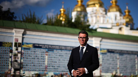 Andy Burnham poses at a military remembrance monument in Kiev, Ukraine, August 24, 2026