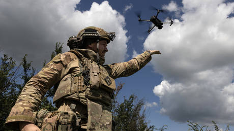 FILE PHOTO: A Ukrainian soldier launching a Shrike drone.