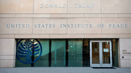 FILE PHOTO: US President Donald Trump's name is seen recently placed on the outside of the United States Institute of Peace (USIP) building headquarters.