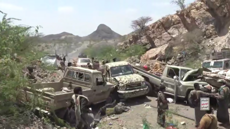 Destroyed vehicles seen in the aftermath of a Houthi ambush on a military convoy of Saudi-backed forces.