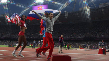 Russian athlete Anna Chicherova (center) celebrates winning the Gold Medal in the Women's High Jump Final during the 2012 Olympic games, London, UK, August 11, 2012.