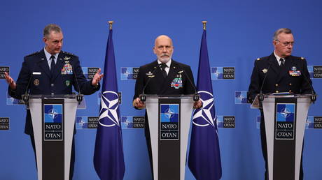 FILE PHOTO: Admiral Giuseppe Cavo Dragone, chair of the NATO Military Committee (C), General Alexus G. Grynkewich, supreme allied commander Europe (L), and Admiral Pierre Vandier, supreme allied commander transformation (R) speak at a press conference at NATO Headquarters in Brussels, Belgium.