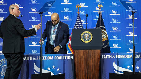 White House aide Gabriel Perez (facing front) prepares a teleprompter, Washington, DC, June 26, 2026.