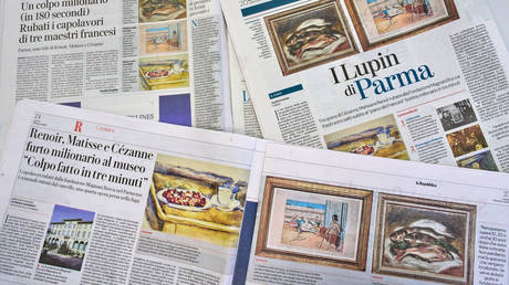 Italian Newspapers carry the news of the heist of three paintings, "Fish" by Auguste Renoir, "Still Life with Cherries" by Paul Cézanne, and "Odalisque on the Terrace" by Henri Matisse, from a museum near Parma, March 30, 2026.