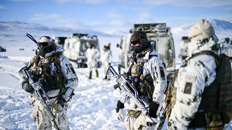 FILE PHOTO: NATO troops stand in the snow during the military exercise Cold Response 26, on March 15, 2026.