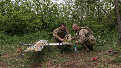 FILE PHOTO: Ukrainian troops preparing a drone for launch.