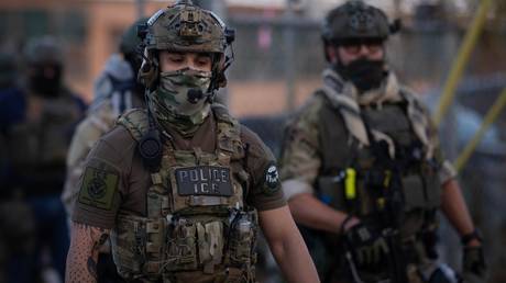 FILE PHOTO: ICE agents countering a protest outside of an immigration processing center in Broadview, Illinois.