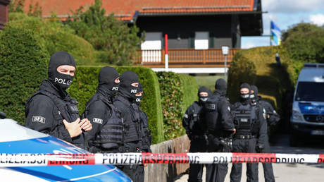Police stand outside a lakeside villa of Russian tycoon Alisher Usmanov during a raid on September 21, 2022 in Rottach-Egern, Germany.