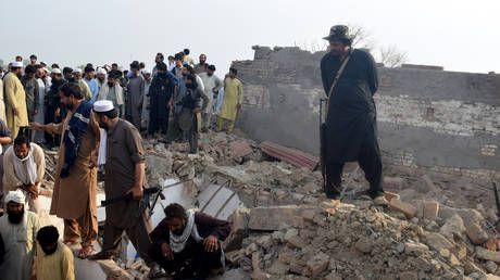 Pakistani security officials at the scene of a car bomb attack at a police post in Bannu, Pakistan, on May 10, 2026. (REPRESENTATIVE IMAGE)