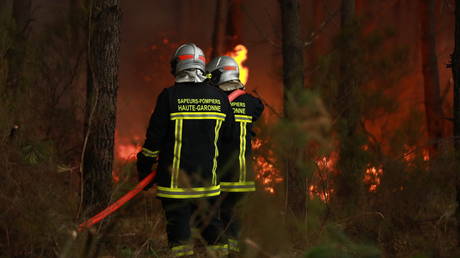 Firefighting operations continue as a wildfire burns near Saint-Jean-d'Illac in southwestern France on July 26, 2026.