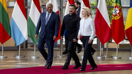 European Commission President Ursula von der Leyen and European Council head, Antonio Costa, arriving at an EU summit in Brussels together with 
Ukraine’s Vladimir Zelensky.