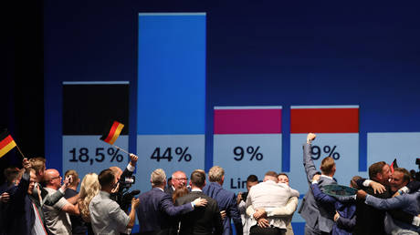 Alternative for Germany (AfD) party supporters cheering as they watch the results of exit polls in Saxony-Anhalt state elections, in Magdeburg, Germany, September 6, 2026.