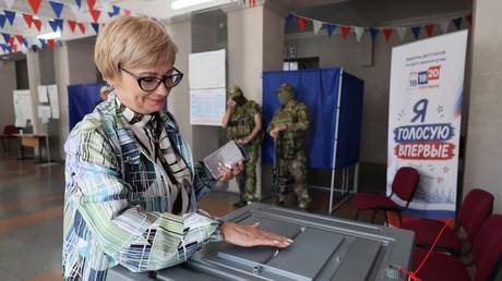A voter casts a ballot at the State Duma election in Russia's Donetsk People's Republic, on September 18, 2026.