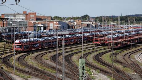Hundreds of vehicles are loaded onto transport cars next to the VW plant in Osnabruck, September 7, 2026