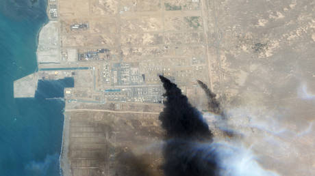 FILE PHOTO: Smoke rises from a Saudi Aramco oil refinery in Jizan, July 26, 2026.