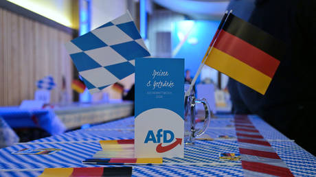Bavarian and German flags at AfD Bavaria’s Ash Wednesday event in Osterhofen, Germany, February 18, 2026.