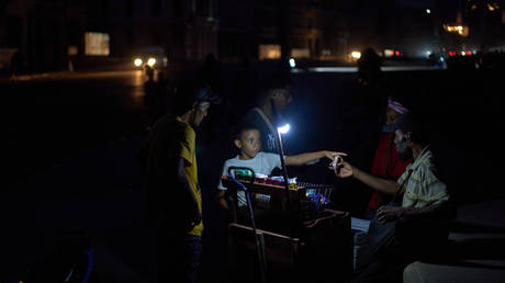 People at the Malecon seawall during a nationwide blackout in Havana, Cuba, September 18, 2026.