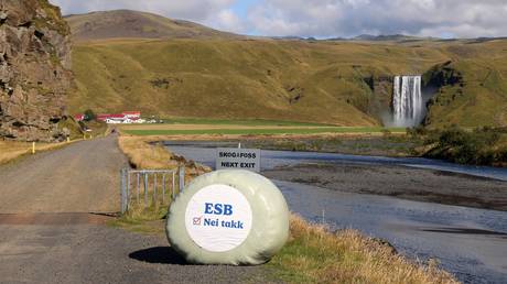 Farmers near Skógafoss display hay bales with the message "EU no thanks" on August 29, 2026 in Skógar, Iceland