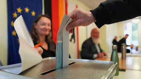 A man casts his ballot in the Berlin state election in Berlin, Germany, September 20, 2026.