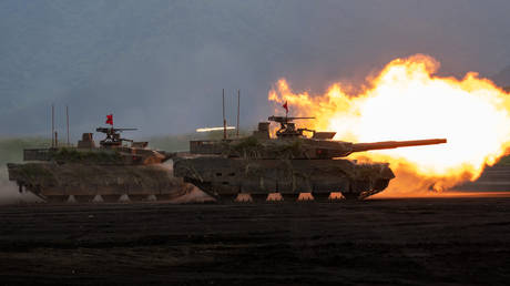 Japan Ground Self-Defense Force main battle tanks fire during an exercise in Gotemba, Japan on June 08, 2025.