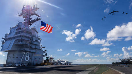 USS Gerald R. Ford, F/A-18E/F Super Hornets, and a US Air Force B-52 Stratofortress operate as a joint, multi-domain force, on November 13, 2025.
