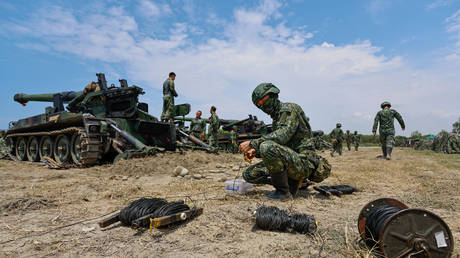 Taiwanese soldiers prepare a live-fire artillery training at a coastal area in Taichung, Taiwan, on August 7, 2024.