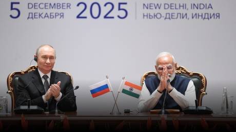 Russian President Vladimir Putin and Indian Prime Minister Narendra Modi attend the India-Russia Trade Forum after their meeting at Hyderabad House in New Delhi, December 5, 2025.