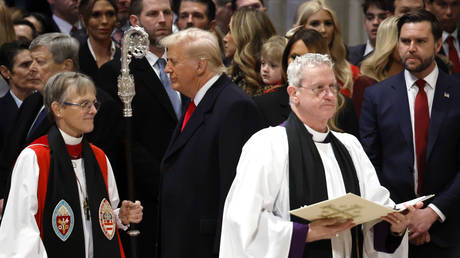 US President Donald Trump (C) and US Vice President J.D. Vance (R) at the National Prayer Service at Washington National Cathedral, January 21, 2025.