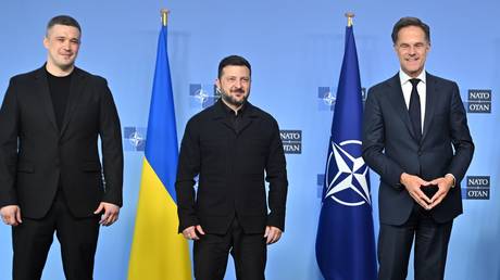 FILE PHOTO: Ukrainian leader Vladimir Zelensky, Defense Minister Mikhail Fedorov, and NATO Secretary-General Mark Rutte in Brussels, Belgium, June 18, 2026.