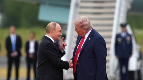 FILE PHOTO: US President Donald Trump greets Russian President Vladimir Putin in Anchorage, Alaska, August 15, 2025.