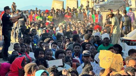 NGOs distribute basic foodstuffs to migrants who entered Ceuta during the mass influx from Morocco, 3 August 2026, Ceuta, Spain.