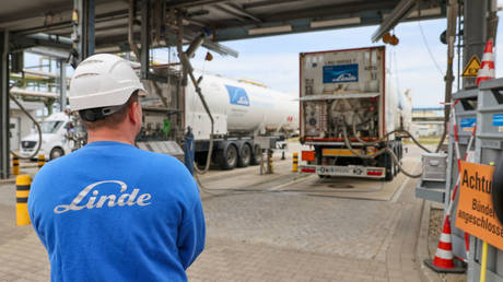 An employee monitors the filling of trucks with liquid hydrogen at Linde AG's Leuna Chemical Park.