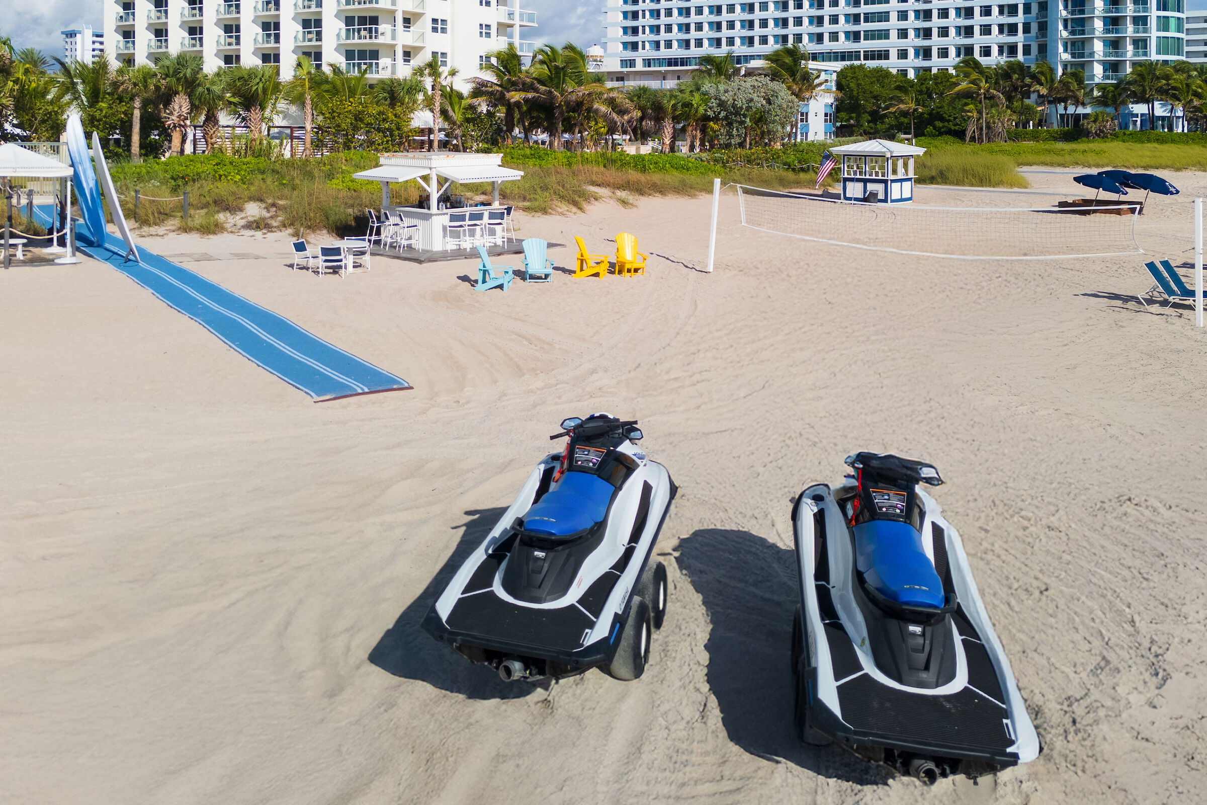 jet skis sit on beach