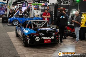 Race cars, performance parts, new products, and motorsports technology on display at PRI Show 2025 in Indianapolis, Indiana.