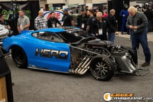 Race cars, performance parts, new products, and motorsports technology on display at PRI Show 2025 in Indianapolis, Indiana.